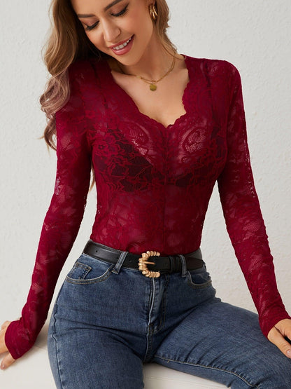 Lace bodysuit with long sleeves and deep neckline